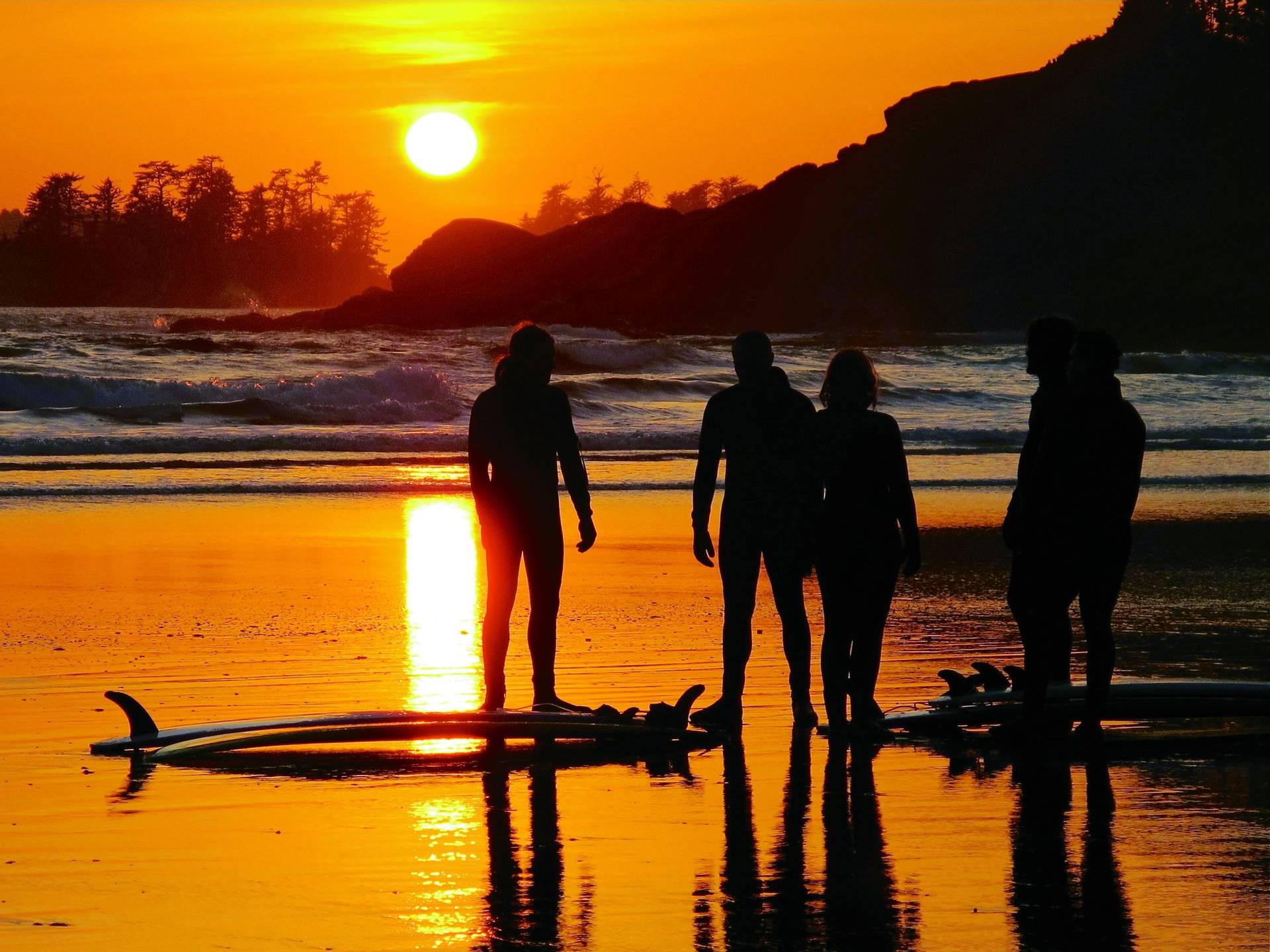 one of the best surf retreats around the world-long-beach-lodge-sunset surfers